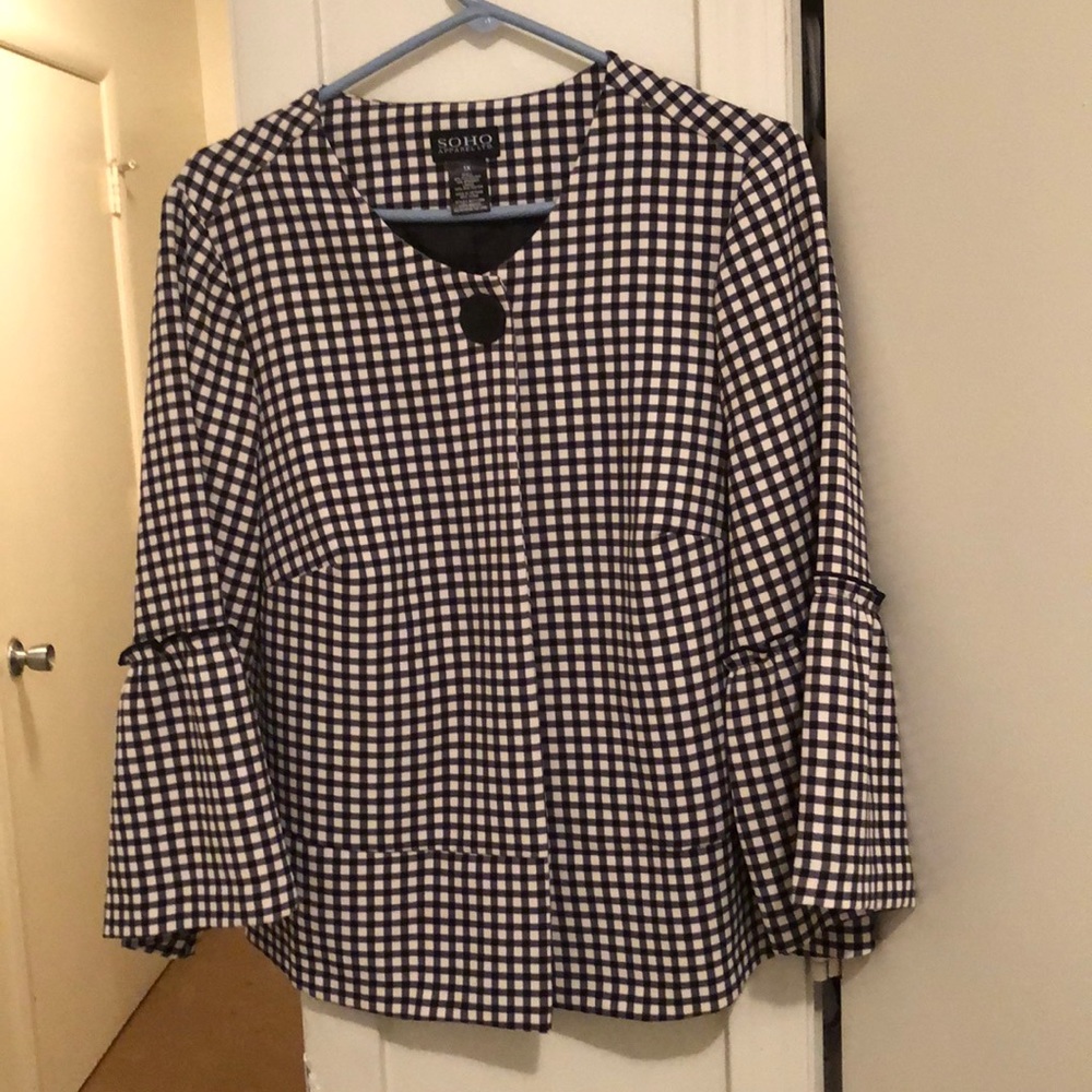 Black and white checked jacket.